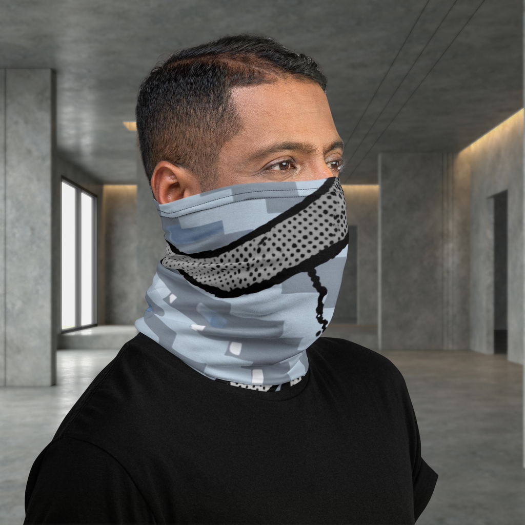 Urban Concrete 6 neck gaiter worn as a face covering in a concrete building, side view.