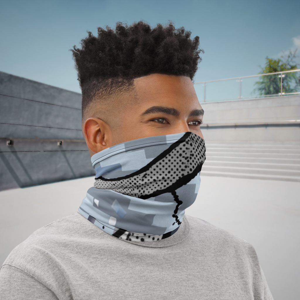 Urban Concrete 6 neck gaiter worn as a face covering at a skatepark, three-quarter view.