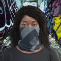 Urban Concrete 8 neck gaiter worn over the nose and mouth against a graffiti wall.