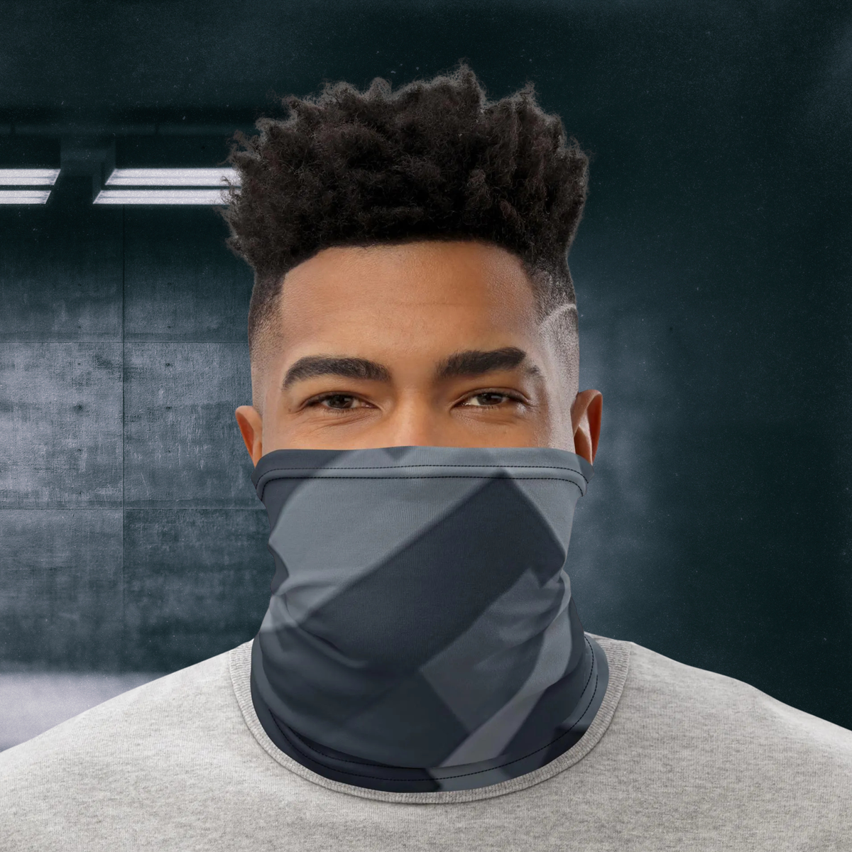Urban Concrete 8 neck gaiter worn over the nose and mouth with a grey T-shirt, front view.