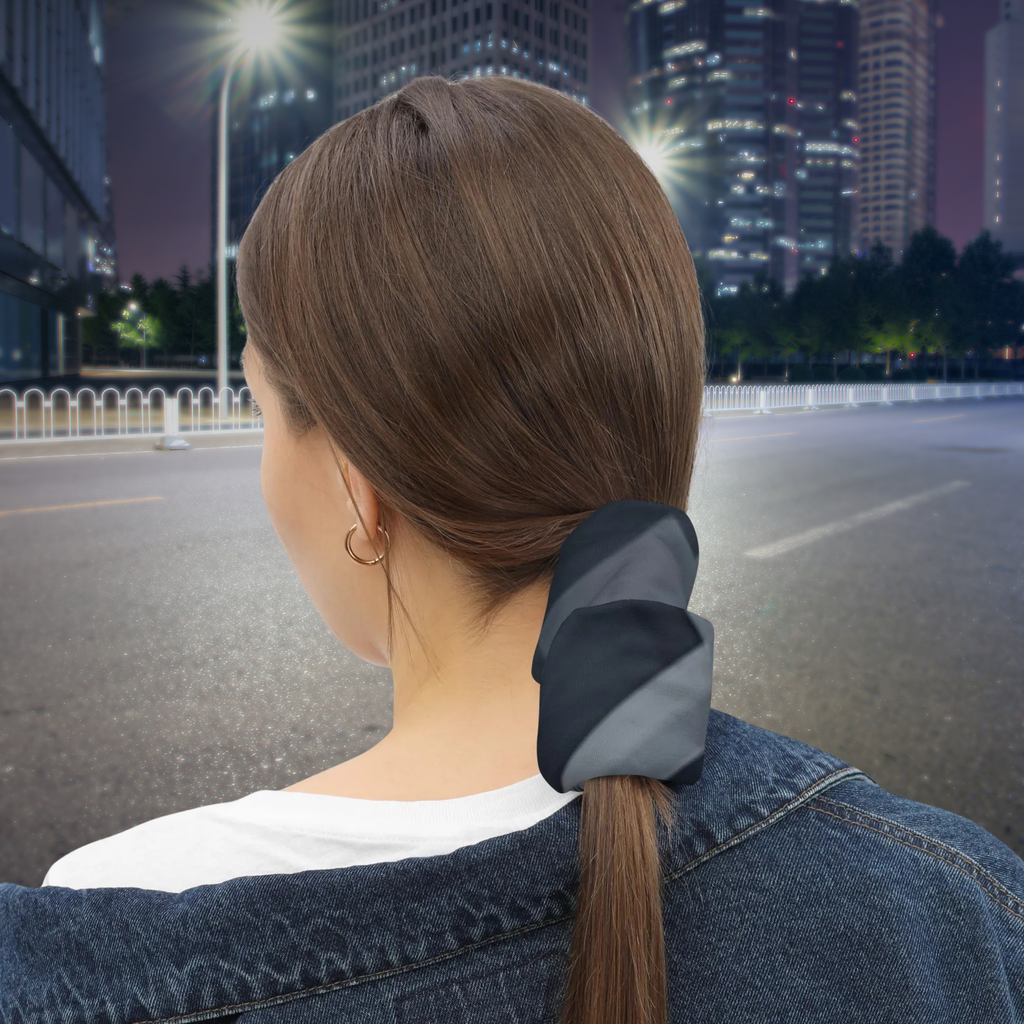 Urban Concrete 8 neck gaiter used as a ponytail wrap on a city street at night, rear view.