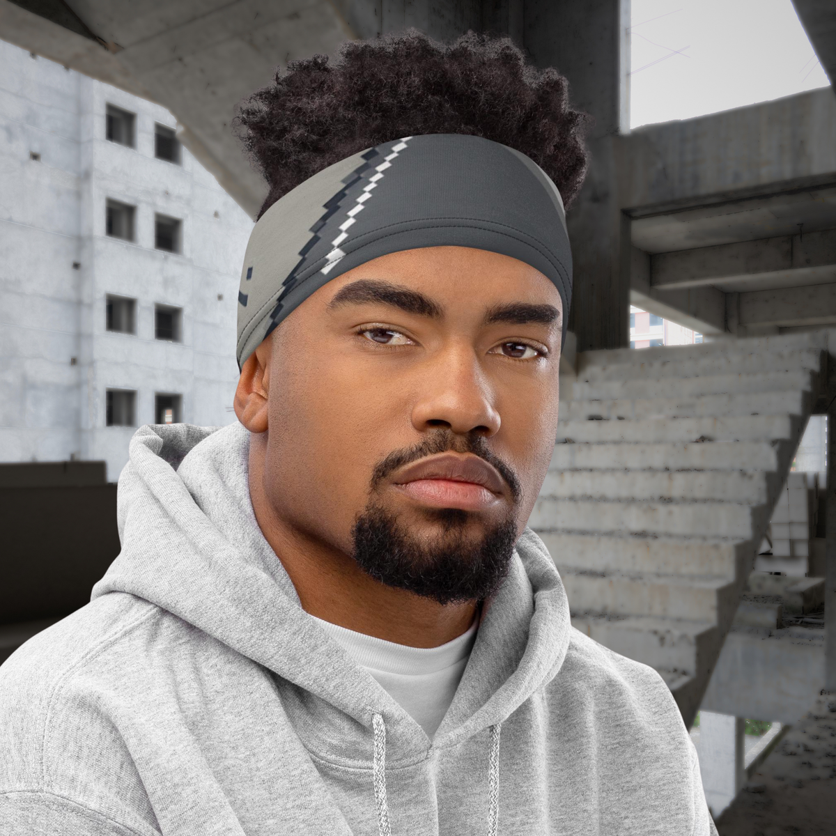 Urban Concrete 10 neck gaiter worn as a headband with a grey hoodie.