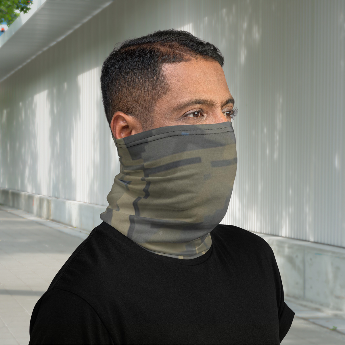 Urban Concrete 7 neck gaiter worn as a face covering in a covered walkway, side view.