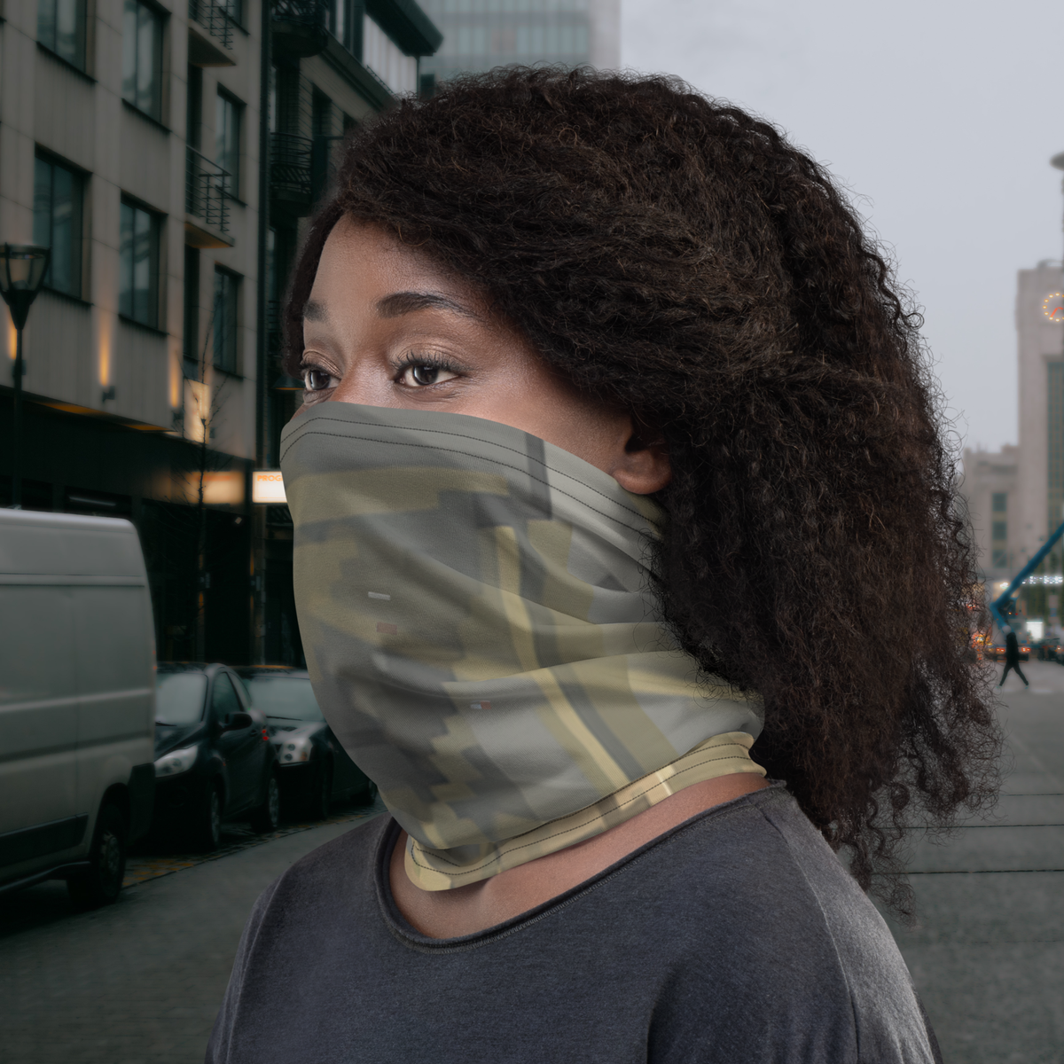 Urban Concrete 7 neck gaiter worn as a face covering on a city street, side view.