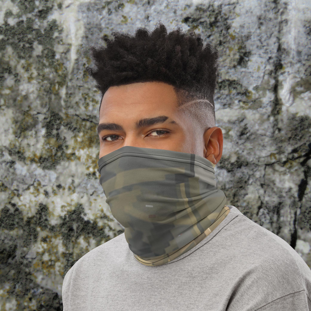 Urban Concrete 7 neck gaiter worn as a face covering against a textured stone wall.