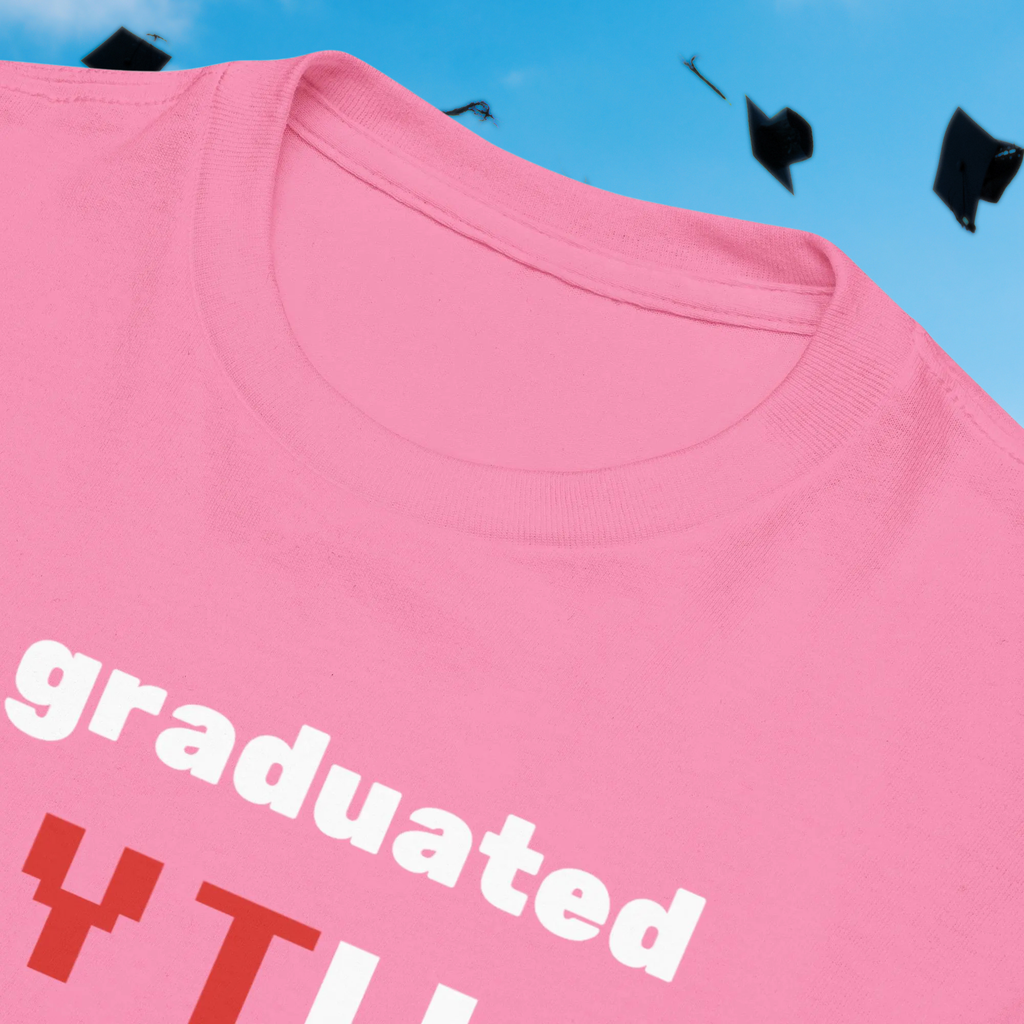 I Graduated YTU kids' T-shirt in pink, close-up of the collar and slogan.