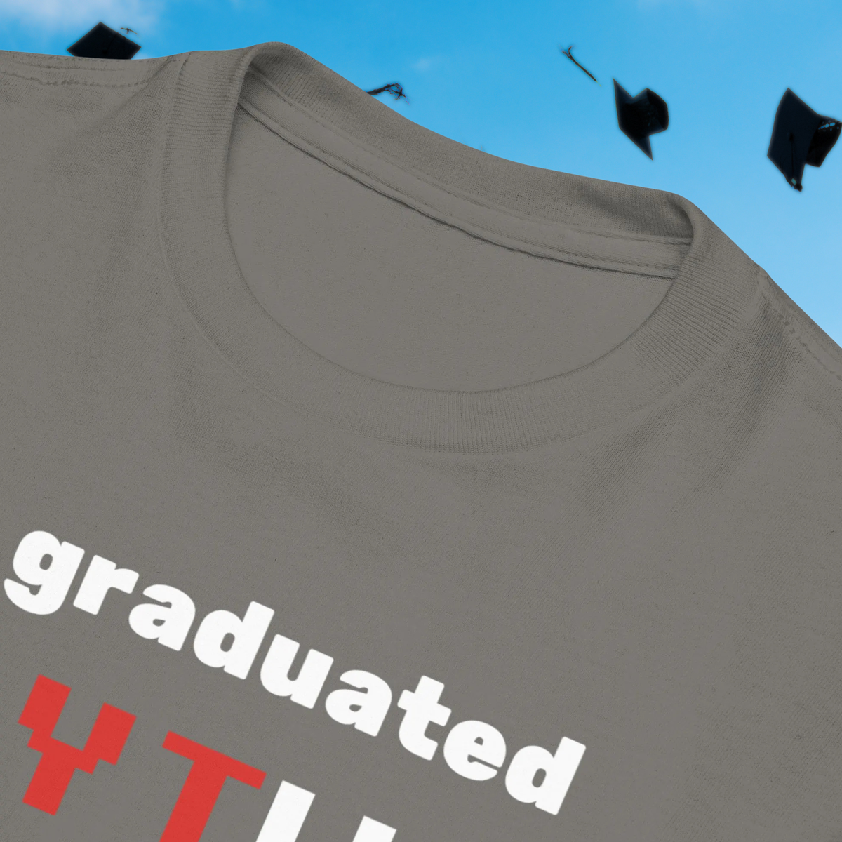 I Graduated YTU kids' T-shirt in charcoal, close-up of the collar and slogan.
