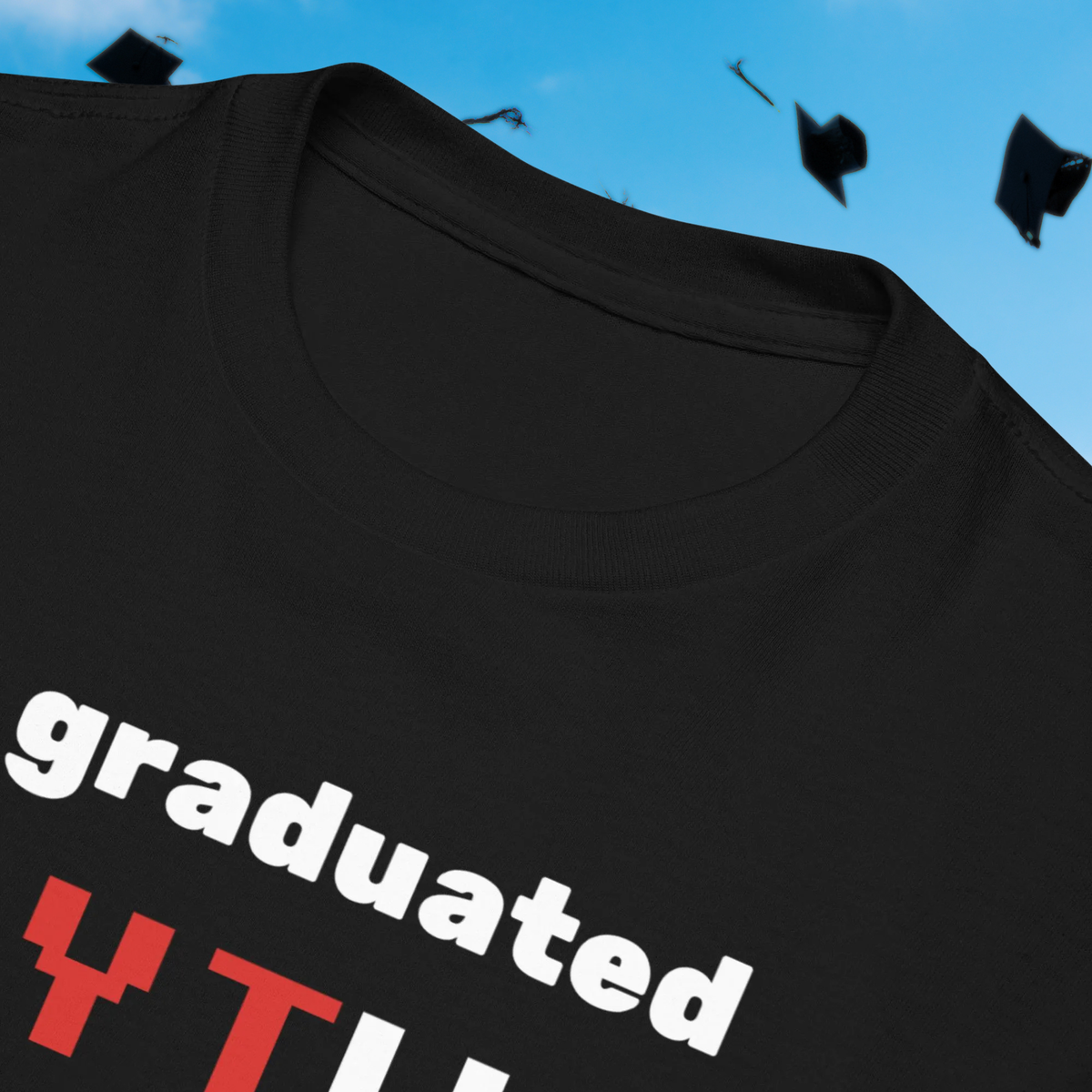 I Graduated YTU kids' T-shirt in black, close-up of the collar and slogan.