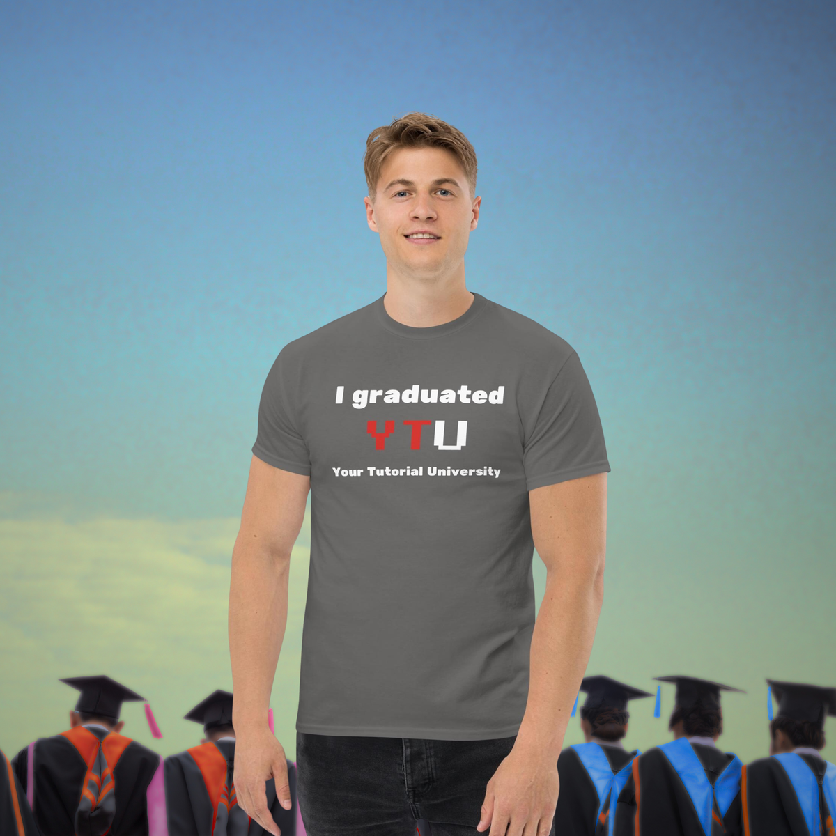 I Graduated YTU T-shirt in charcoal, worn by a model with a graduation crowd behind.