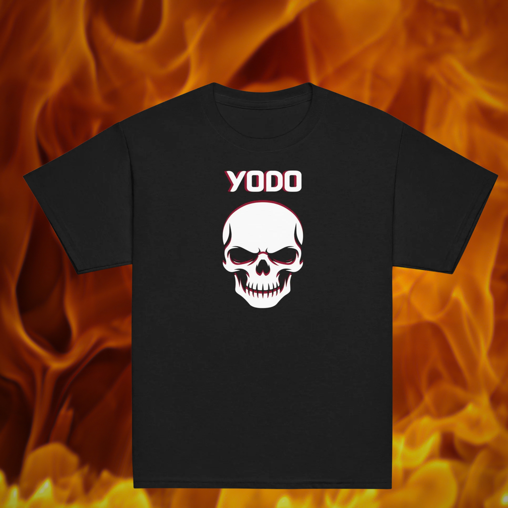 Black kids' YODO Halloween T-shirt with a white skull and red accents, shown against a flame background.