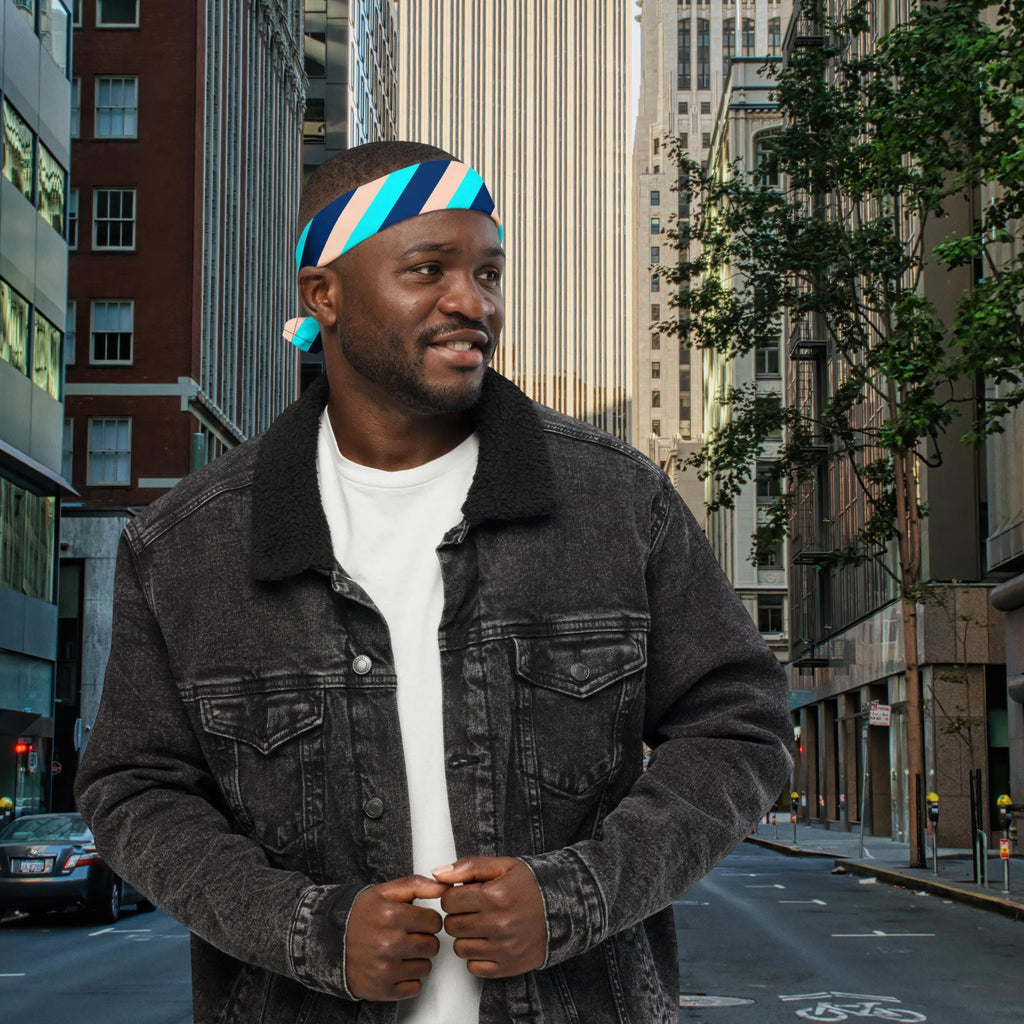 Blue Stripe bandana worn as a headband with a dark denim jacket on a city street.