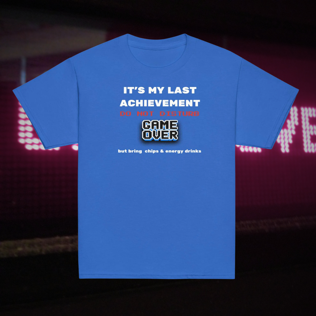 It's My Last Achievement kids' gamer T-shirt in royal blue, front product view against neon gaming lights.