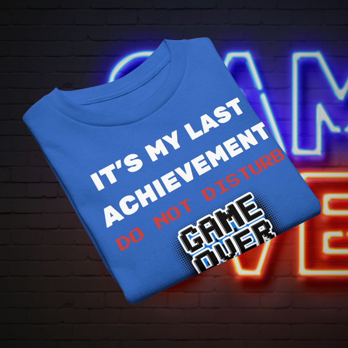 It's My Last Achievement kids' gamer T-shirt in royal blue, folded to show the slogan and Game Over graphic.