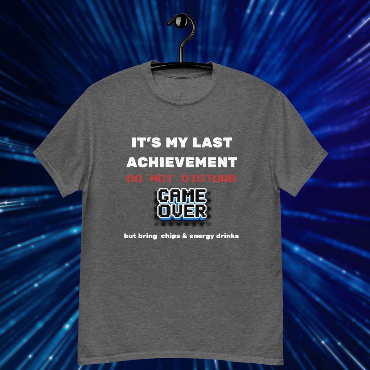It's My Last Achievement gamer T-shirt in dark heather grey, hanging front view against blue light rays.