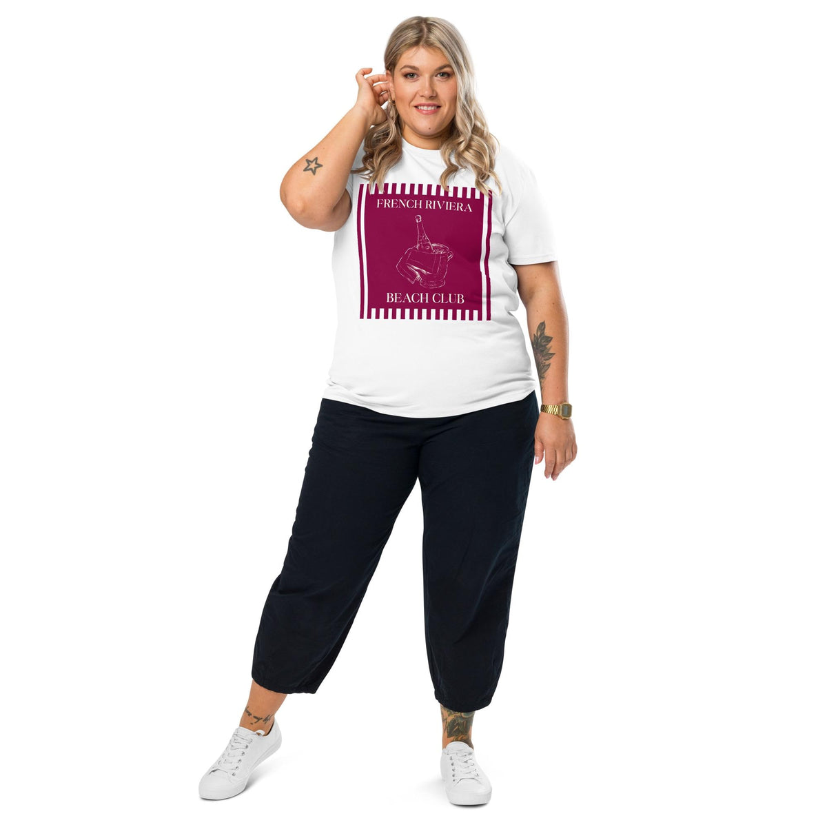 French Riviera Beach Club T-shirt in white, full-length view on a model with black trousers.