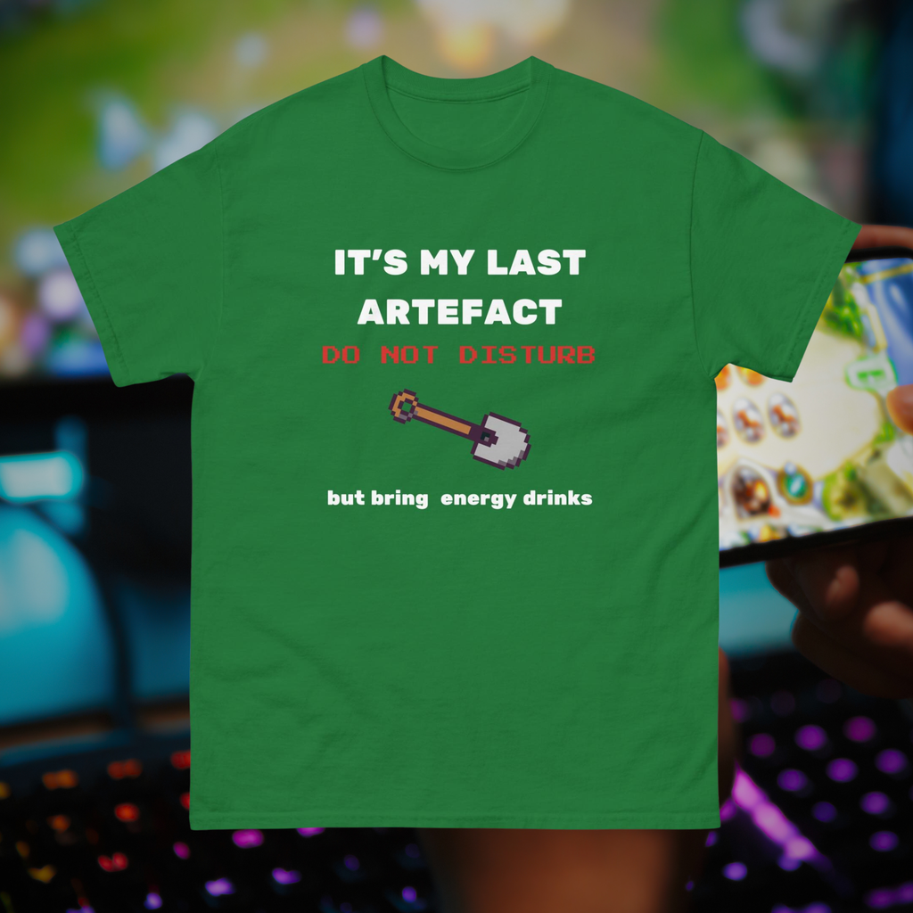 It's My Last Artefact gamer T-shirt in green, front product view against a gaming setup.