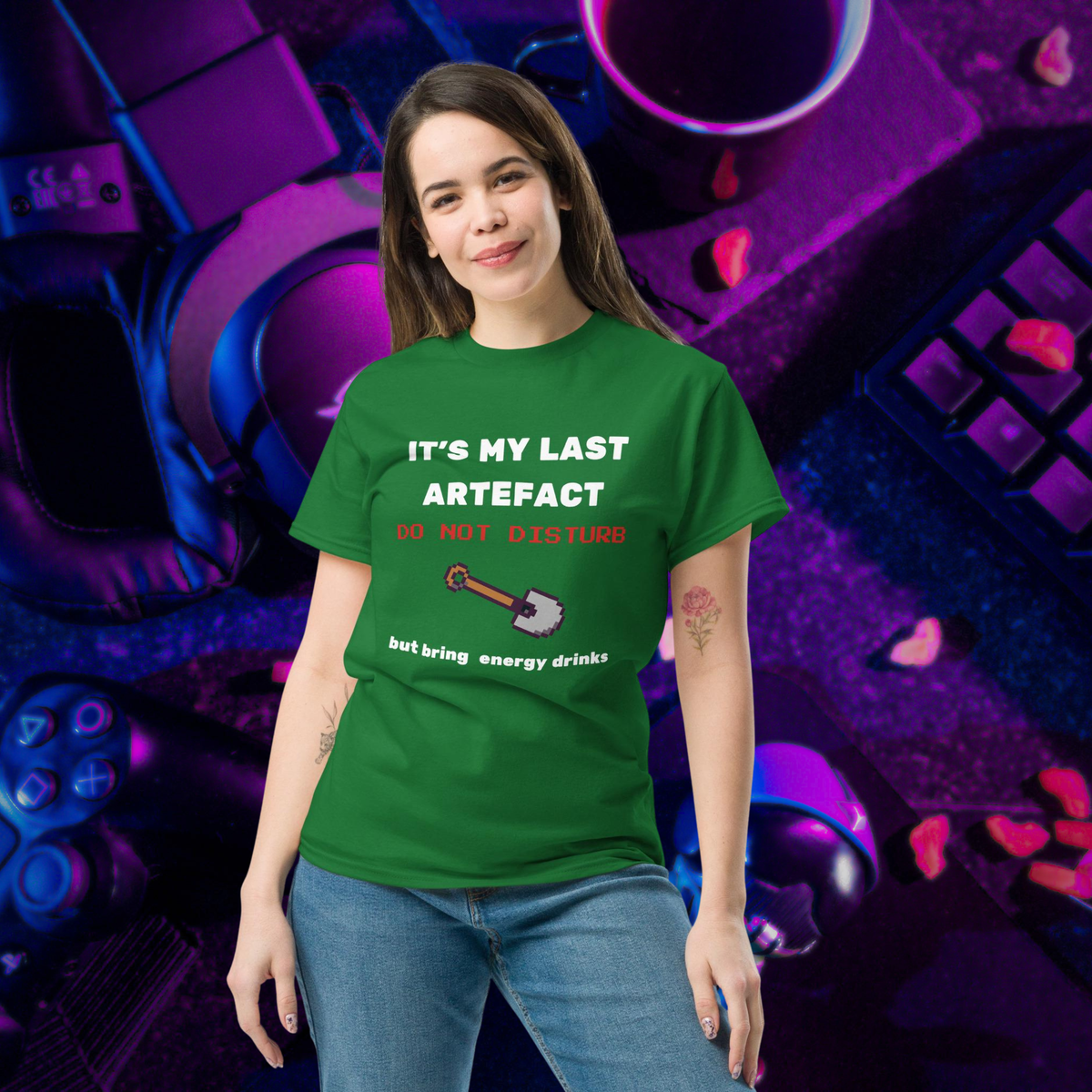 It's My Last Artefact gamer T-shirt in green, worn by a model against a purple controller backdrop.