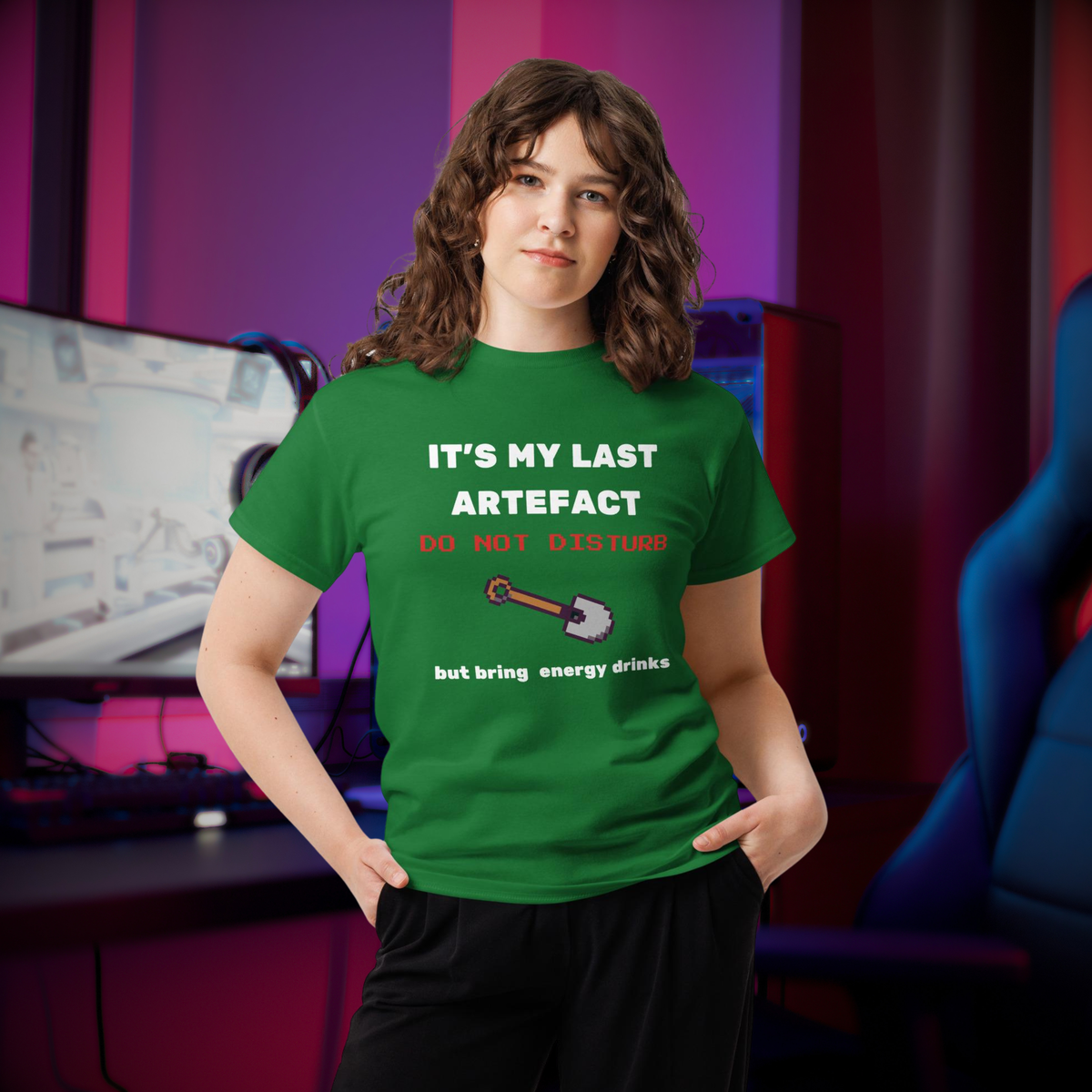 It's My Last Artefact gamer T-shirt in green, worn by a model beside a gaming setup.