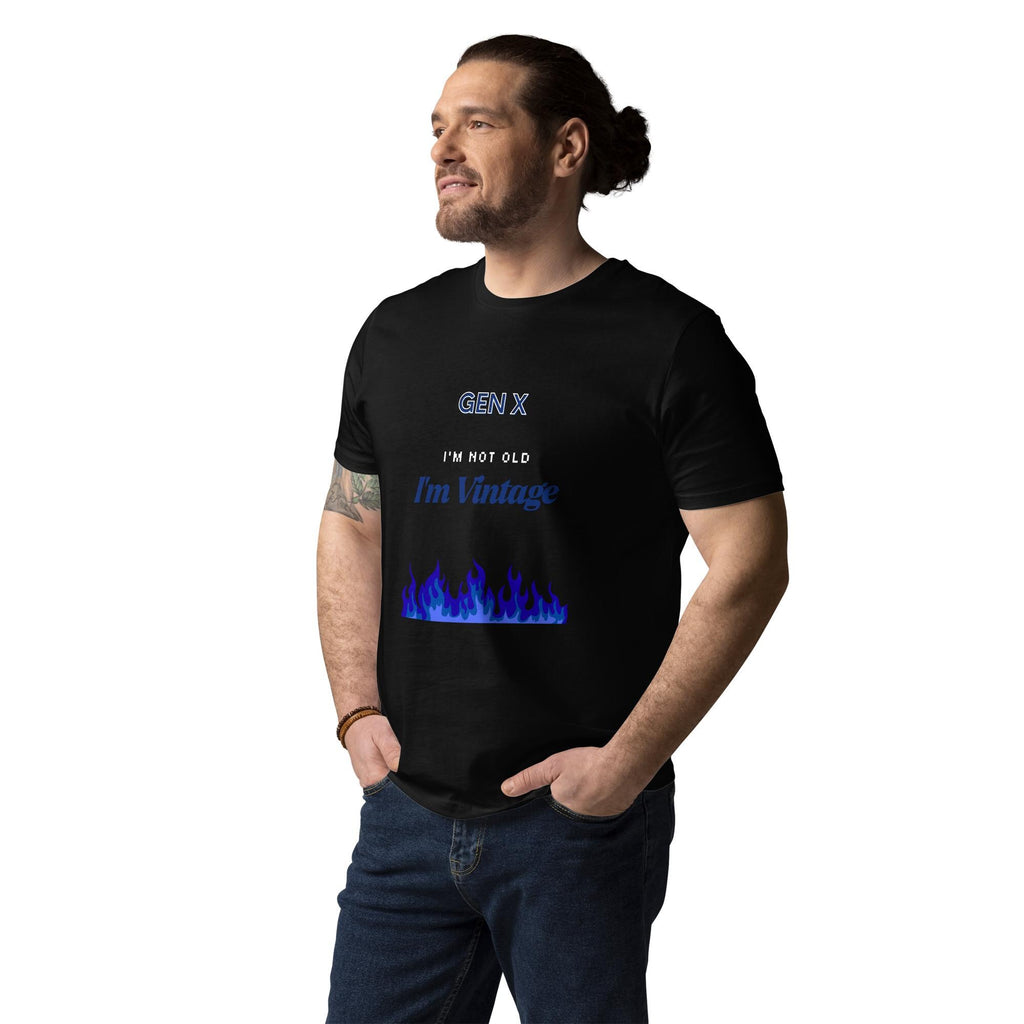 Gen X Blue Flame Vintage T-shirt in black, worn by a model with hands in pockets, three-quarter view.