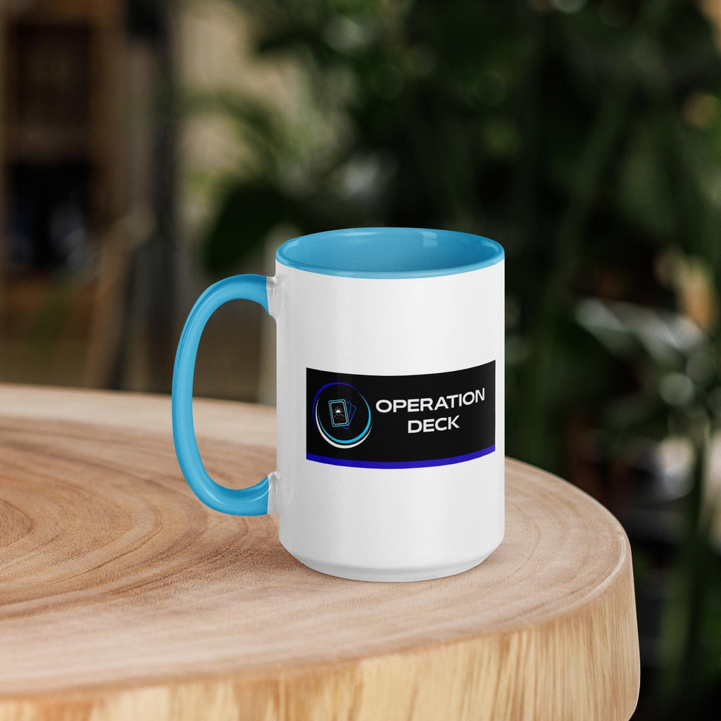 Operation Deck Bien Joué mug logo side on a round wooden table.
