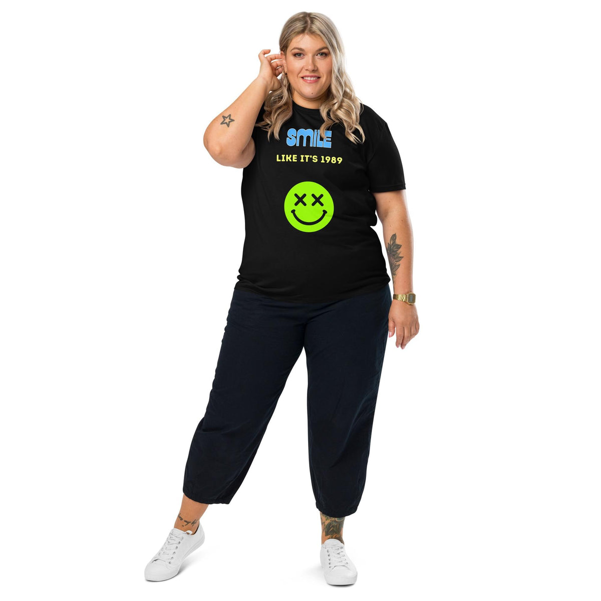 Smile Like It's 1989 rave T-shirt in black, full-length view on a model with black trousers.