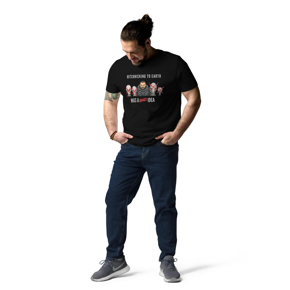 Alien Hitchhiking T-shirt in black, full-length view on a model looking down at the print.