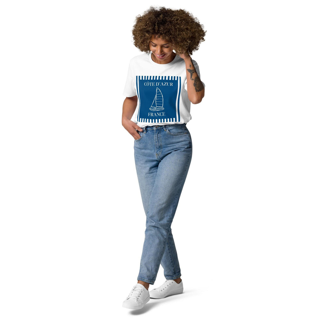 Côte d'Azur sailboat T-shirt in white, full-length view on a model with blue jeans.