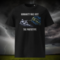 Humanity Prototype AI alien T-shirt in black, front product view of the creation-style artwork against a storm.