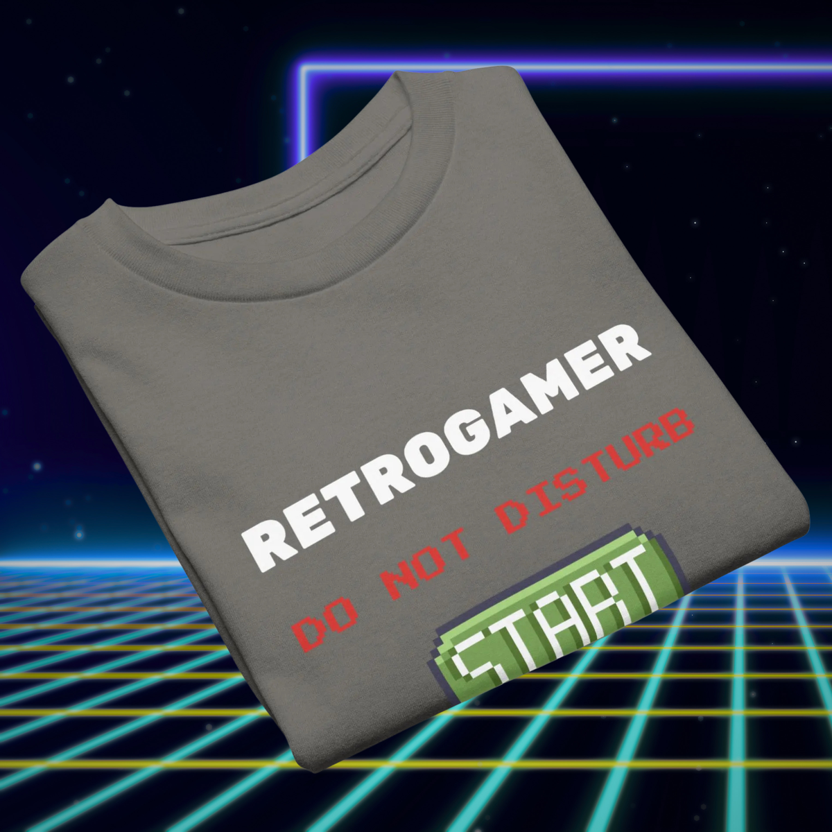 Retrogamer kids' T-shirt in charcoal, folded to show the slogan and pixel Start button.