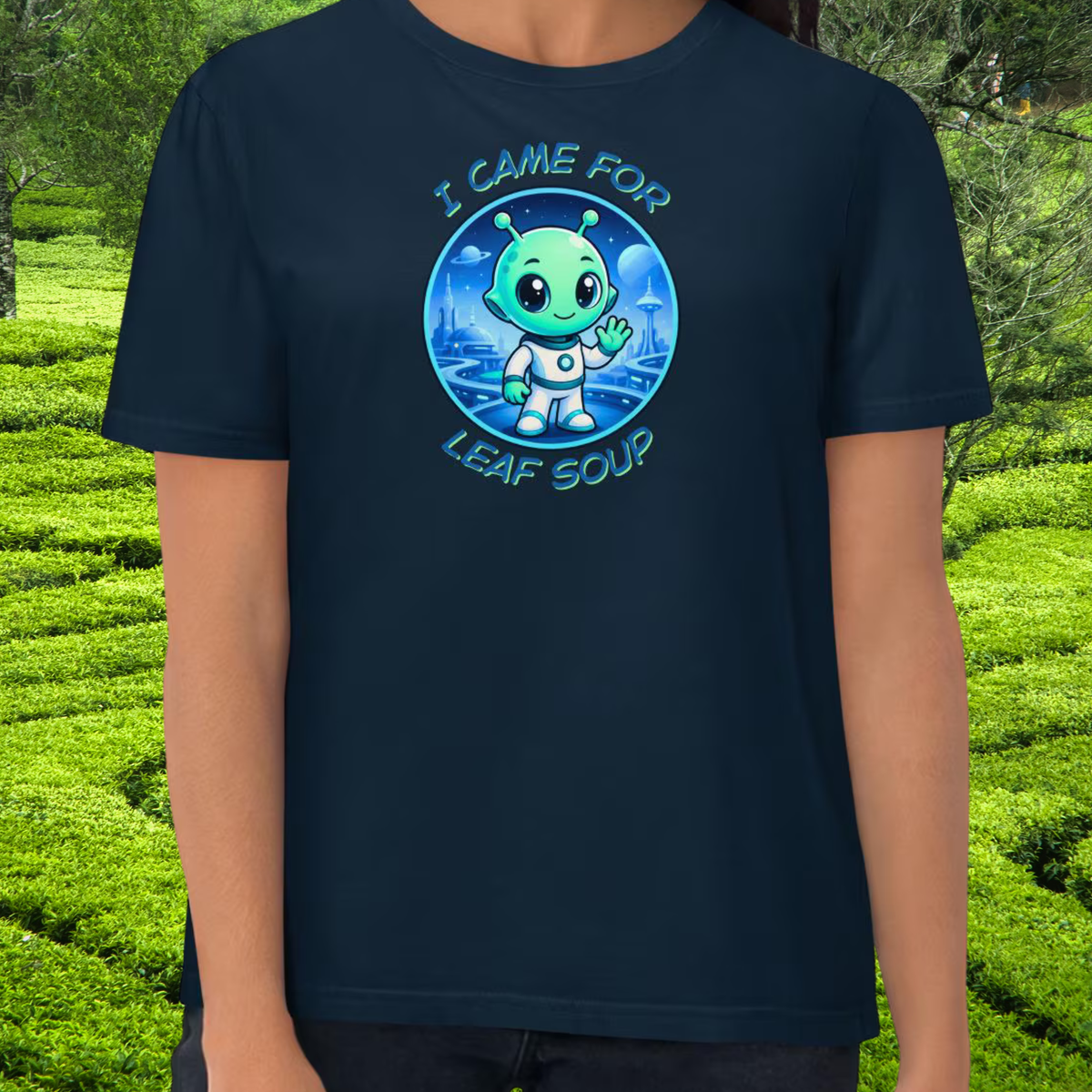 Alien Leaf Soup T-shirt in navy, torso view showing the colorful alien badge.